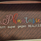 Stickdatei Spruch - Phantasie hilft super gegen Realität - Sewando