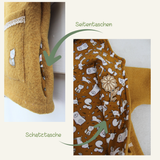 Detailansicht der Kinderjacke Tove mit Seitentaschen und versteckter Schatztasche