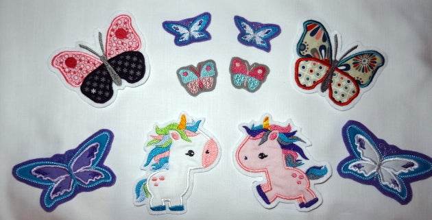 Stickdatei Einhorn und Schmetterling mit Regenbogen - Sewando