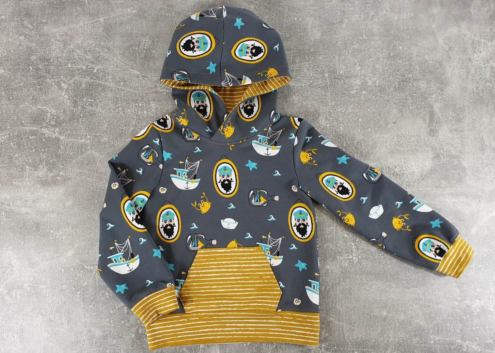 Schnittmuster Kim - Kinderhoodie mit Kapuze oder Wickelkragen Gr. 86-158 - Sewando